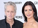 All over: Catherine Zeta Jones and Michael Douglas - and their 25 year age gap - is all over