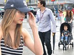 Wherefore art thou, Romeo? Miranda Kerr left trailing behind with little Flynn as eager Orlando Bloom dashes to sports stadium
