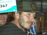 Good night out boys? David Beckham looks tired as he speeds away in a taxi after partying in London with his best pal Dave Gardner 