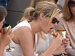 Chowing down: Kate Upton tucked into a meaty sandwich at Day 13 of the US Open on Saturday