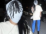 Hiding something? Lady Gaga wears mask and teeters on high heels outside her New York City apartment building