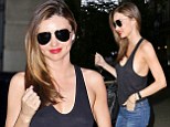 What tennis match? Miranda Kerr ensures all eyes are on her at US Open as she goes bra-less under a skimpy black top