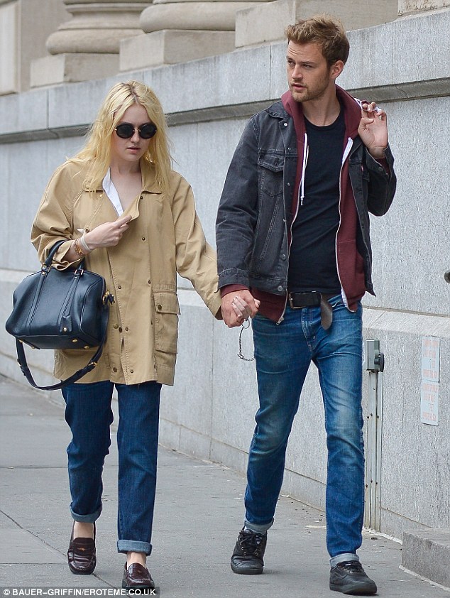 Not her best: Dakota Fanning looked pale and disheveled as she stepped out for a Monday stroll in Manhattan with her boyfriend Jamie Strachan