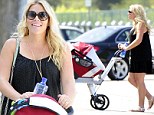 Someone's been busy! Busy Philipps shows off gym results in short black dress just two months after giving birth to baby Cricket