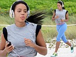 Angela Simmons shows fine form in blue and grey workout gear during beach side run in Miami