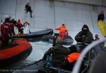 Russian border guards detaining Greenpeace activists scaling Gazprom's oil rig on Wednesday