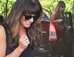 Never give up... on style! Lea Michele looks effortlessly chic in a black blouse, jeans and towering heels