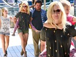 Lift me mommy! Jennie Garth gives her daughter Fiona, seven, a piggy back ride on a family outing with new beau Michael Shimbo