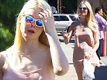 Elle Fanning looks ghostly as she goes shopping for Halloween outfit 