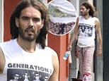 Ever heard of a wallet? Russell Brand keeps his cash tucked into the waistband of his yoga pants