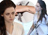 Real or fake? Kristen Stewart's latest arm artwork prompts speculation she's got more tattoos... though the dodgy handiwork suggests otherwise