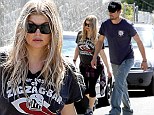 Snapping back in no time! Fergie displays her incredible post-baby body in tight workout leggings as she and husband Josh Duhamel check on home renovations 