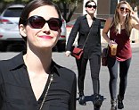 Wardrobe staples: Hilary Duff wore black leggings on Tuesday while visiting her sister in Beverly Hills, while Emmy Rossum opted for a similar style in Los Angeles