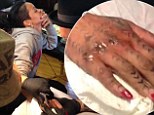 Hardcore! Rihanna grimaces as she gets a Maori tribal tattoo inked the traditional way... with a chisel and mallet