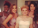 Here comes the bride! Kelly Clarkson dons gorgeous wedding dress while performing her Christmas song on The View