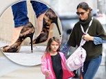 She won't blend in with those! Katie Holmes dashes around in camouflage high heels while taking Suri to school