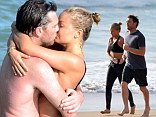 When Lara Bingle and Sam Worthington couldn't get any cuter, they decided to share a PDA on Sydney Beach.