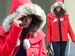 Mila Kunis hides under her furry hood as she channels Little Red Riding Hood on a rare cold and rainy day in Los Angeles