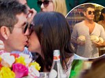Not romantic... Simon Cowell was seen kidding his fiancee Lauren Silverman with his eyes wide open as the two dined at The Ivy in Los Angeles, California on Saturday