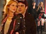 Pictured: Lindsay Lohan sports knee-high leather boots and mini-skirt for night out with ex-assistant Gavin Doyle... a year after they fell out over driving arrest