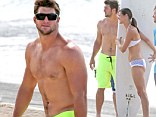 Shirtless Tim Tebow seems carefree as he enjoys the Hawaii surf with sister while the search for a new NFL team continues 
