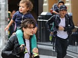 Get a grip! Orlando Bloom hoists his adorable son Flynn for a ride atop his shoulders during New York stroll