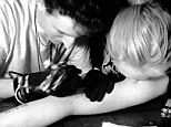 New ink: Lindsay Lohan posted a picture Sunday of her getting a new tattoo 