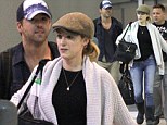 Ryan Reynolds and wife Blake Lively are a co-ordinating couple as they jet into New Orleans in casual caps