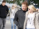 Not in public! Anna Faris does some on the spot grooming as she fingers her bed-head on a romantic stroll with similarly tousled Chris Pratt