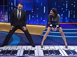 Fun and games: Tom Hanks and Sandra Bullock play on an over-sized piano, recalling Tom's role in the 1988 film Big 
