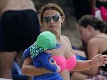 Get away: Coleen Rooney escaped the chilly English weather for the beaches of Barbados 