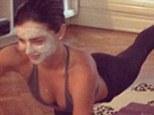 Beauty regiment: Miranda dons hydrating facial mask while doing stretching exercises