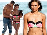 The Vampire Diaries' Kat Graham sizzles in tiny bikini during romantic beach stroll with her fiance Cottrell Guidry