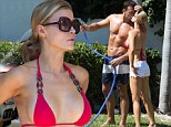 How's that for detailing! Joanna Krupa gives husband Romain Zago a helping hand by washing the car...in a little red bikini