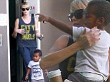 He's her number one! Charlize Theron scoops son Jackson up into her arms as they enjoy a day of bonding after actress lunches with mystery man
