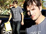 Environmentally-conscious Ashton Kutcher steps out in 'bike is the new car' T-shirt after being named TV's highest-paid actor