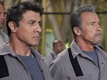 Getting out: Sylvester Stallone and Arnold Schwarzenegger put their greying heads together to break free from a prison