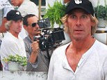 On set: Michael Bay filming the latest Transformers installment in Hong Kong on Thursday, the same day he was attacked by two brothers who demanded an 8,000 payment from him