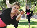 Brandi Glanville shows off her impressive yoga moves during early morning work out in the park