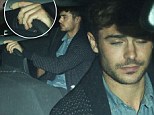 Zac Efron celebrates low-key birthday with bandaged fingers at Chateau Marmont following widely reported rehab stay