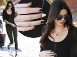 She's nailed it! Kendall Jenner matches monochrome manicure with her footwear as she pumps gas 