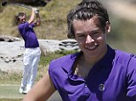 Swing time! Harry Styles sports purple polo top and bright white trousers for a day on the golf course
