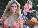 That's the spirit! Brandi Glanville gets her hands dirty with a festive trip to the pumpkin patch with her sons
