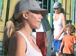 Something to hide? Kendra Wilkinson steps out in a looser-fitting tank top and baggy shorts amidst pregnancy rumours 