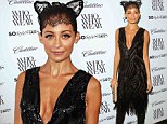 Feline good! Nicole Richie looks purrrfect as she teams lace cat ears with a plunging Flapper dress
