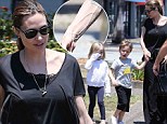 Angelina Jolie displays sinewy, veiny arms while escorting twins through Australia