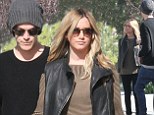 In this together: Ashley Tisdale and her fianc Christopher French held hands as they looked at a possible home to purchase in Los Angeles, California on Sunday