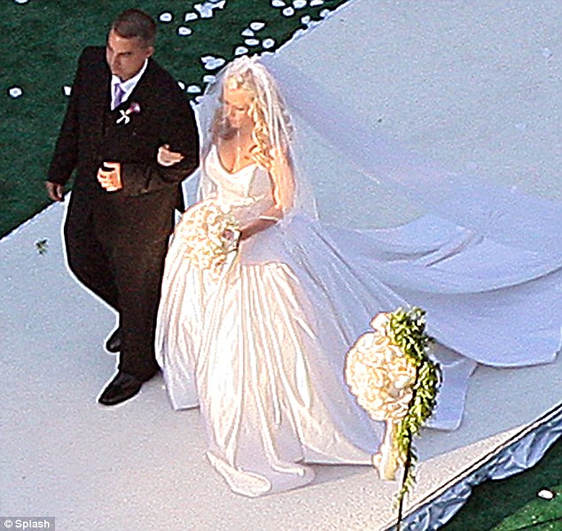 She promised to love Hank forever: The pinup being walked down the aisle by her brother at the Playboy mansion in 2009