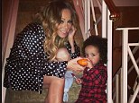 Her little pumpkin: Mariah Carey shared a special moment on Sunday by posting this cute picture of Roc with a miniature pumpkin