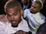 Pictured: Chris Brown is released after pleading 'not guilty' as assault charge is reduced from felony to misdemeanour